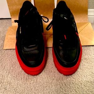 Cardi B Reebok athletic shoes. black/red